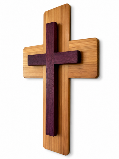 Angled view of handcrafted layered wood Christian wall cross with purpleheart accent
