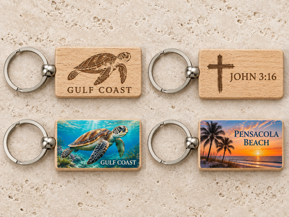 Illustrative design mockups: Gulf Coast turtle, John 3:16 and Pensacola Beach keychains